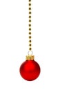 Red Christmas ornament on string of gold beads over white