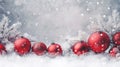 Red Christmas ornaments with frosted tree branches in snow