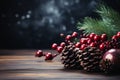 Red Christmas ornaments, holly berries, cones and fir tree branches on dark wooden table. Christmas background with copy space Royalty Free Stock Photo
