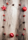 Red Christmas ornaments on a rustic wooden background. Xmas card Royalty Free Stock Photo