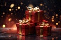 Red Christmas presents with gold bow and ribbon. Gift boxes with festive illumination lights on a dark brown blurred background. Royalty Free Stock Photo