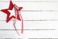 Red christmas star with bells on white wooden background, copy space Royalty Free Stock Photo