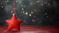 Red Christmas Star Ornament Hanging on Starry Backdrop Royalty Free Stock Photo