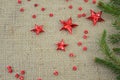 Red Christmas stars and a fir tree branch Royalty Free Stock Photo