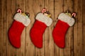 Red Christmas stocking on old wooden background 3D rendering Royalty Free Stock Photo