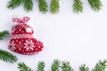 Red Christmas stocking on white background, frame of green contiferous fir tree braches