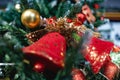 Red Christmas toy bells on a spruce branch Royalty Free Stock Photo