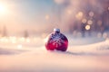 Red Christmas tree decoration or Christmas ball decor sit on the white snow on holiday snowy beautiful soft dreamy winter