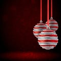 Christmas tree ornaments hanging. Balls made of glass or plastic hanging over abstract background Royalty Free Stock Photo