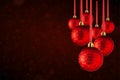 Christmas tree ornaments hanging. Balls made of glass or plastic hanging over abstract background Royalty Free Stock Photo