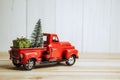 Red Christmas truck with pine tree and gift. Merry Christmas and happy new year concept Royalty Free Stock Photo