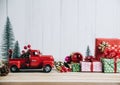 Red Christmas truck with pine tree and gift. Merry Christmas and happy new year concept Royalty Free Stock Photo