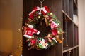 Red christmas wreath with decorations. Holiday interior Royalty Free Stock Photo