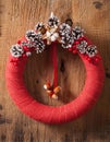 Red christmas wreath handmade diy wooden background Royalty Free Stock Photo