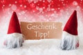 Red Christmassy Gnomes With Card, Geschenk Tipp Means Gift Tip Royalty Free Stock Photo