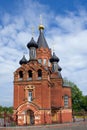 Red Church with black cupolas Royalty Free Stock Photo