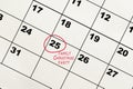 Red circle mark on the calendar at 25 for reminder of family christmas party