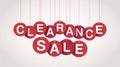 Red circular tags with white letters spelling CLEARANCESALE hanging with shadow Royalty Free Stock Photo