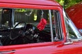 Red Classic car with black dashboard and red dice Royalty Free Stock Photo