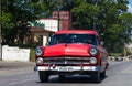 A red classic car drived on the street in havana city Royalty Free Stock Photo