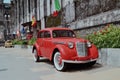 Red classic car in heritage palace