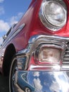 Red classic car partial front and side view Royalty Free Stock Photo