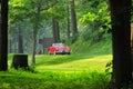 Red classic car on the road