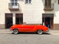 Red classic Cuban vintage car. American classic car on the road in Havana, Cuba.