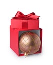 Red classic gift box with satin bow and brown Christmas tree ball Royalty Free Stock Photo