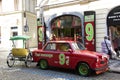 Red classic retro car for people and travelers take photo at old town near Charles Bridge Royalty Free Stock Photo