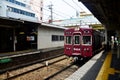 Red classic train of Hankyu kyoto line running from Kyoto station go to Numba station at Osaka