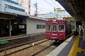 Red classic train of Hankyu kyoto line running from Kyoto station go to Numba station at Osaka