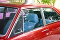 Red classic vintage car with blue leather seats from the 90s a beautiful vibe in the 1990s style,concept of 90s,old cars from the Royalty Free Stock Photo