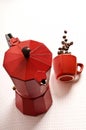 Red classical moka coffee maker pot with red cup and coffee cafe beans Royalty Free Stock Photo