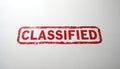 Red CLASSIFIED stamp with distressed border on white background. Official, confidential document marking implies secrecy, Royalty Free Stock Photo