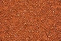 Red clay court tennis background texture. Tennis court close-up of gravel surface Royalty Free Stock Photo