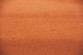 Red clay court tennis background texture. Tennis court close-up of gravel surface Royalty Free Stock Photo