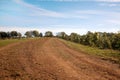 Red Clay Farm Road with blue sky Royalty Free Stock Photo