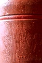 Wet red ceramic surface against bright background