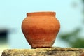 Red clay pot put on a stone