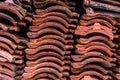 Red clay roof tile put in the stack after old tenement renovation, texture, pattern Royalty Free Stock Photo