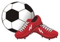 Red cleats and ball Royalty Free Stock Photo