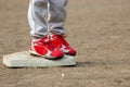 Red Cleats on Base