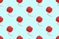 Red clew seamless pattern on pastel blue background. Ball of woolen thread for knitting. Design concept template Royalty Free Stock Photo