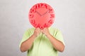 Red clock in front of head. Royalty Free Stock Photo