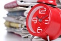 Red clock and newspaper Royalty Free Stock Photo