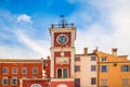 A red clock tower at The Marsala Tita Square in Rovinj.