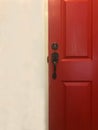 Red close wooden door and white wall