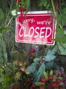 A red closed sign hanging outside a shop, restaurant, store, office or others Royalty Free Stock Photo