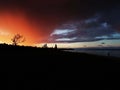 Red clouds roll in over the lake Royalty Free Stock Photo